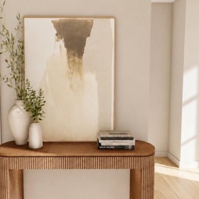 a room with a table and a painting on the wall