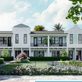 a white building with a black fence