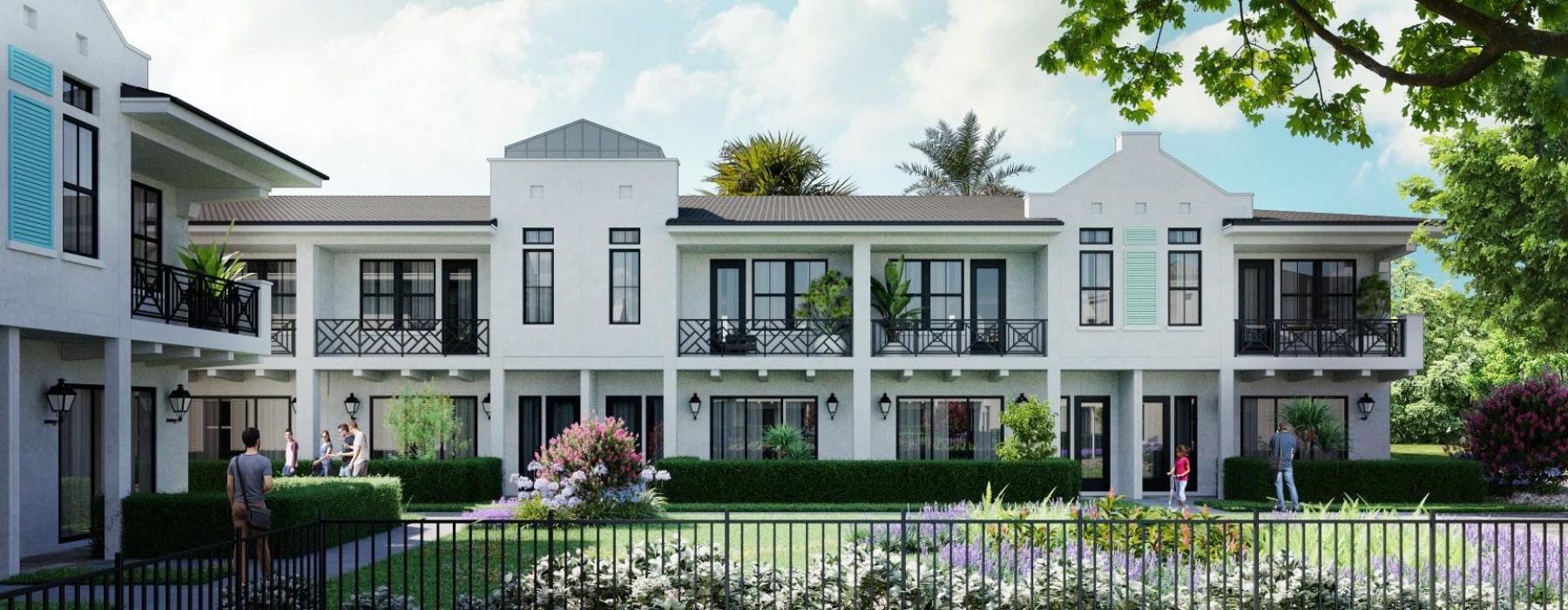 a white building with a black fence